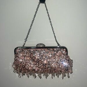 Pink sequin clutch handbag with a silver chain and pink satin inside!